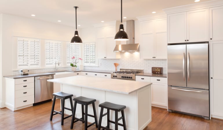 Plantation shutters allow you to control the amount of natural light in a room. Plantation shutters in a model kitchen.